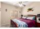 This is a bedroom with a ceiling fan and a window with plantation shutters at 1015 S Val Vista Dr # 81, Mesa, AZ 85204