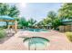 A community pool and spa area, surrounded by lush landscaping and shaded seating at 1015 S Val Vista Dr # 81, Mesa, AZ 85204