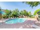 Community pool with lounge chairs, umbrellas, and lush greenery for relaxation at 1015 S Val Vista Dr # 81, Mesa, AZ 85204