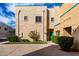 A two story condo with beige stucco exterior and a well-maintained front yard at 1015 S Val Vista Dr # 81, Mesa, AZ 85204