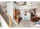 Bright living room with a staircase, desk nook, and dining area, offering an open and connected living space at 1015 S Val Vista Dr # 81, Mesa, AZ 85204