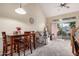 Cozy living room with large windows and a view of the outdoor space with a pool at 1015 S Val Vista Dr # 81, Mesa, AZ 85204