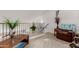 Open loft area with neutral carpet, a comfortable chair, and a view of the lower level at 1015 S Val Vista Dr # 81, Mesa, AZ 85204