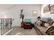 Cozy loft with comfortable sofa and chair, offering a relaxed space with soft, neutral carpeting at 1015 S Val Vista Dr # 81, Mesa, AZ 85204