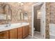 Detailed main bathroom with dual vanities, mirrors, decorative wallpaper, and private toilet room at 1015 S Val Vista Dr # 81, Mesa, AZ 85204