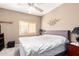 Comfortable main bedroom featuring neutral tones, ample natural light, and ceiling fan at 1015 S Val Vista Dr # 81, Mesa, AZ 85204