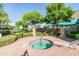 Community spa featuring mature landscaping, wrought iron fence and seating at 1015 S Val Vista Dr # 81, Mesa, AZ 85204