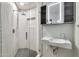 Stylish bathroom with glass shower, modern sink, and illuminated mirror cabinet at 1040 E Osborn Rd # 404, Phoenix, AZ 85014