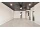 Open bedroom featuring a modern ceiling fan and light gray tiled floors at 1040 E Osborn Rd # 404, Phoenix, AZ 85014