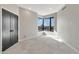 Comfortable bedroom with natural light, tile floor and a scenic cityscape view at 1040 E Osborn Rd # 404, Phoenix, AZ 85014