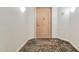 Neutral colored front door with decorative carpet and trim at 1040 E Osborn Rd # 404, Phoenix, AZ 85014