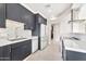 Modern kitchen featuring a white backsplash, stainless steel appliances, and ample cabinet space at 1040 E Osborn Rd # 404, Phoenix, AZ 85014