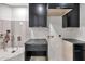 Clean and well-organized laundry room with ample counter space and storage at 1040 E Osborn Rd # 404, Phoenix, AZ 85014
