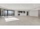 Open concept living area featuring sleek tile floors, recessed lighting, and access to the large, covered balcony at 1040 E Osborn Rd # 404, Phoenix, AZ 85014
