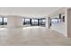 Open living space with sleek tile, a wall of windows, and a convenient pass-through to the kitchen at 1040 E Osborn Rd # 404, Phoenix, AZ 85014