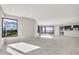Bright living area with large windows, tiled floors, recessed lighting, and views of the city at 1040 E Osborn Rd # 404, Phoenix, AZ 85014