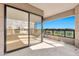 Spacious outdoor patio with golf course and city views through sliding glass doors at 1040 E Osborn Rd # 404, Phoenix, AZ 85014
