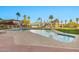 Enjoy the community pool surrounded by palm trees and well-manicured landscaping at 1040 E Osborn Rd # 404, Phoenix, AZ 85014