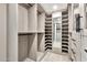 Organized walk-in closet featuring custom shelving and ample storage space at 1040 E Osborn Rd # 404, Phoenix, AZ 85014
