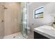 Contemporary bathroom features a glass shower, modern fixtures, and geometric tile at 10541 E Windrose Dr, Scottsdale, AZ 85259