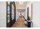 Bright foyer with hardwood floors and contemporary lighting at 10541 E Windrose Dr, Scottsdale, AZ 85259