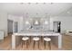 Spacious kitchen with a large island and seating with pendant lights at 10541 E Windrose Dr, Scottsdale, AZ 85259