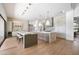 Bright kitchen with dual islands, pendant lighting, and hardwood floors at 10541 E Windrose Dr, Scottsdale, AZ 85259