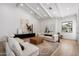 Spacious living room featuring vaulted ceilings, hardwood floors, and contemporary decor at 10541 E Windrose Dr, Scottsdale, AZ 85259