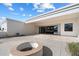Expansive outdoor patio featuring seamless indoor-outdoor living space, including an outdoor fire pit at 10541 E Windrose Dr, Scottsdale, AZ 85259