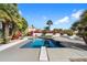 Inviting backyard pool with a diving board offering a perfect spot for summer fun and relaxation at 10541 E Windrose Dr, Scottsdale, AZ 85259