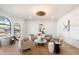 Well-lit sitting room with hardwood floors, a modern light fixture, and comfortable seating at 10541 E Windrose Dr, Scottsdale, AZ 85259