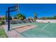 Outdoor court with tennis and basketball, surrounded by lush landscaping providing shade and privacy at 10541 E Windrose Dr, Scottsdale, AZ 85259