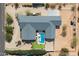 Bird's-eye view displaying the roof, pool, and landscaping of a single-Gathering home at 11212 N Miller Rd, Scottsdale, AZ 85260