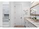Bathroom featuring a walk-in shower and a vanity with granite countertops at 11212 N Miller Rd, Scottsdale, AZ 85260