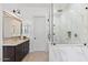 Bathroom featuring a glass enclosed shower, single vanity with granite counters and modern fixtures at 11212 N Miller Rd, Scottsdale, AZ 85260