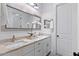 Bathroom featuring a double vanity, granite countertops, modern fixtures, and recessed lighting at 11212 N Miller Rd, Scottsdale, AZ 85260