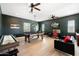 A large game room offers a pool table, shuffleboard, and media center providing entertainment for all at 11212 N Miller Rd, Scottsdale, AZ 85260