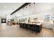 Spacious kitchen features an oversized kitchen island with seating and open floor plan into living area at 11212 N Miller Rd, Scottsdale, AZ 85260