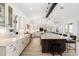 Elegant kitchen with a large island, custom cabinetry, and modern appliances provides a stunning focal point at 11212 N Miller Rd, Scottsdale, AZ 85260
