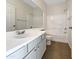 Clean bathroom featuring a vanity, large mirror, and a shower over tub with tile surround at 1131 E Catino St, San Tan Valley, AZ 85140