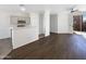 Spacious living area with hardwood floors, ceiling fan, and sliding glass door to the exterior at 1131 E Catino St, San Tan Valley, AZ 85140