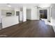 Open living room with stainless steel appliances, hardwood floors and access to the backyard at 1131 E Catino St, San Tan Valley, AZ 85140