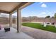 Lush backyard with artificial turf, large patio, and mountain views in the distance at 1236 E Mescal St, Phoenix, AZ 85020