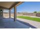 Relaxing covered patio opens to a well maintained backyard with artificial grass and privacy fence at 1236 E Mescal St, Phoenix, AZ 85020