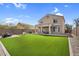 Spacious backyard with artificial turf, patio, and room for entertaining at 1236 E Mescal St, Phoenix, AZ 85020