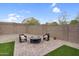 Private backyard with a patio area with comfortable chairs and a fire pit at 1236 E Mescal St, Phoenix, AZ 85020