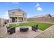 Well-manicured backyard with artificial turf, patio, and comfortable outdoor seating at 1236 E Mescal St, Phoenix, AZ 85020