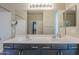 Bathroom featuring a double sink vanity, large mirror, and modern fixtures at 1236 E Mescal St, Phoenix, AZ 85020