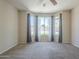 Bright bedroom with large windows offering views of the backyard at 1236 E Mescal St, Phoenix, AZ 85020