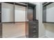 Walk-in closet with custom shelving and drawers for optimal organization at 1236 E Mescal St, Phoenix, AZ 85020
